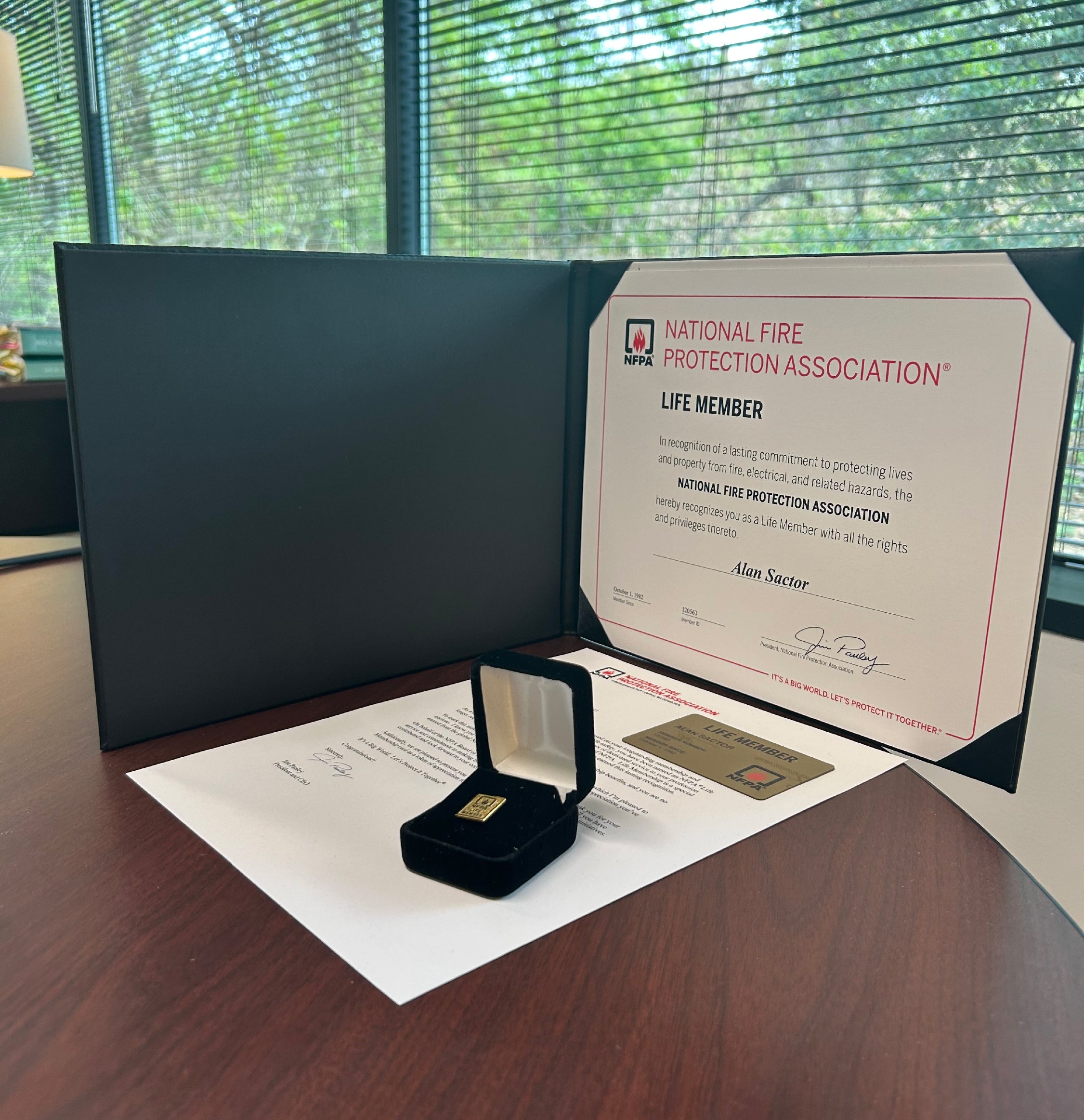  Alan received a Life Member certificate, commemorative pin, and official membership card