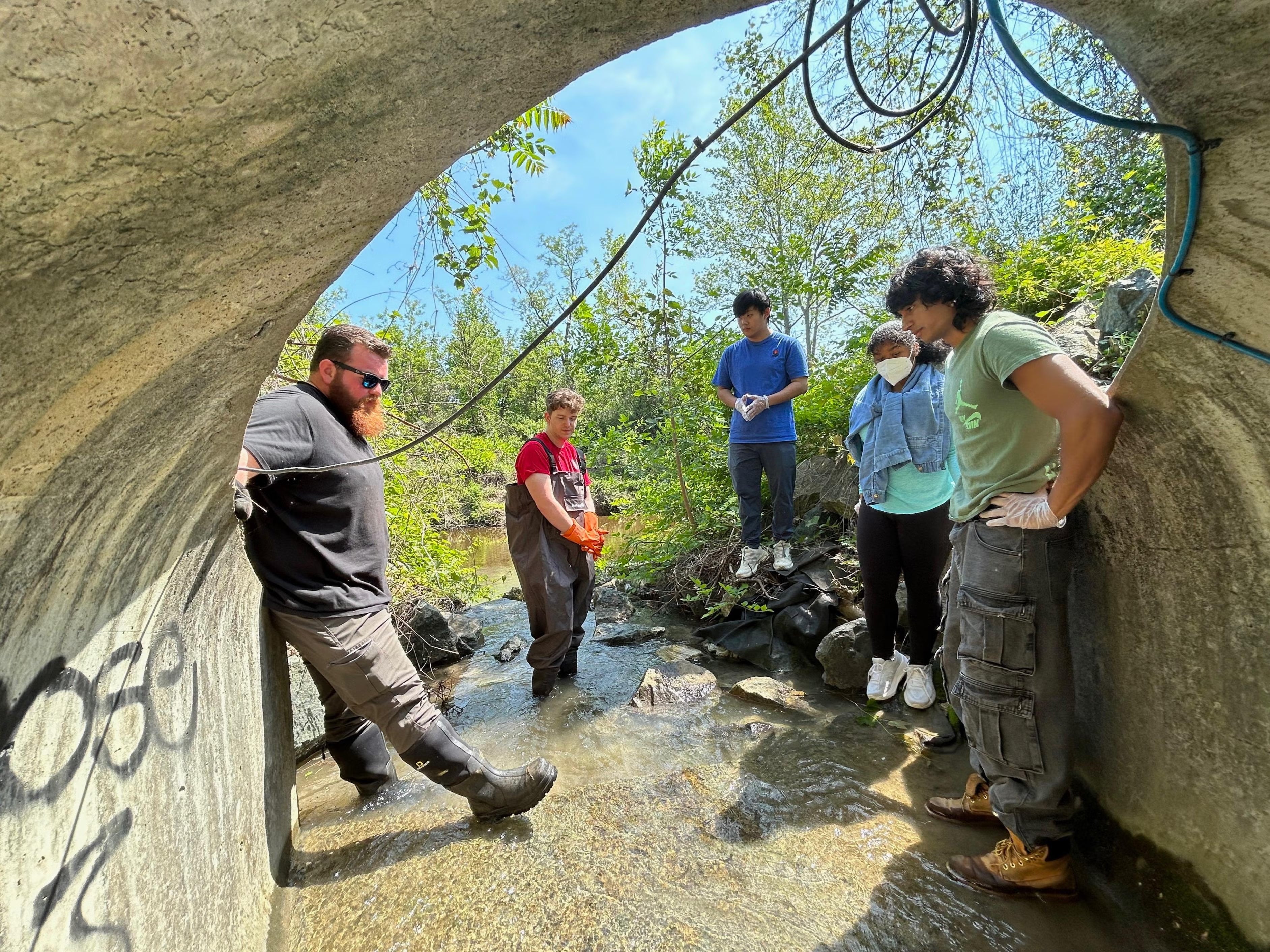 Environmental Affair staff collaborating with Office of Sustainability to take sample water