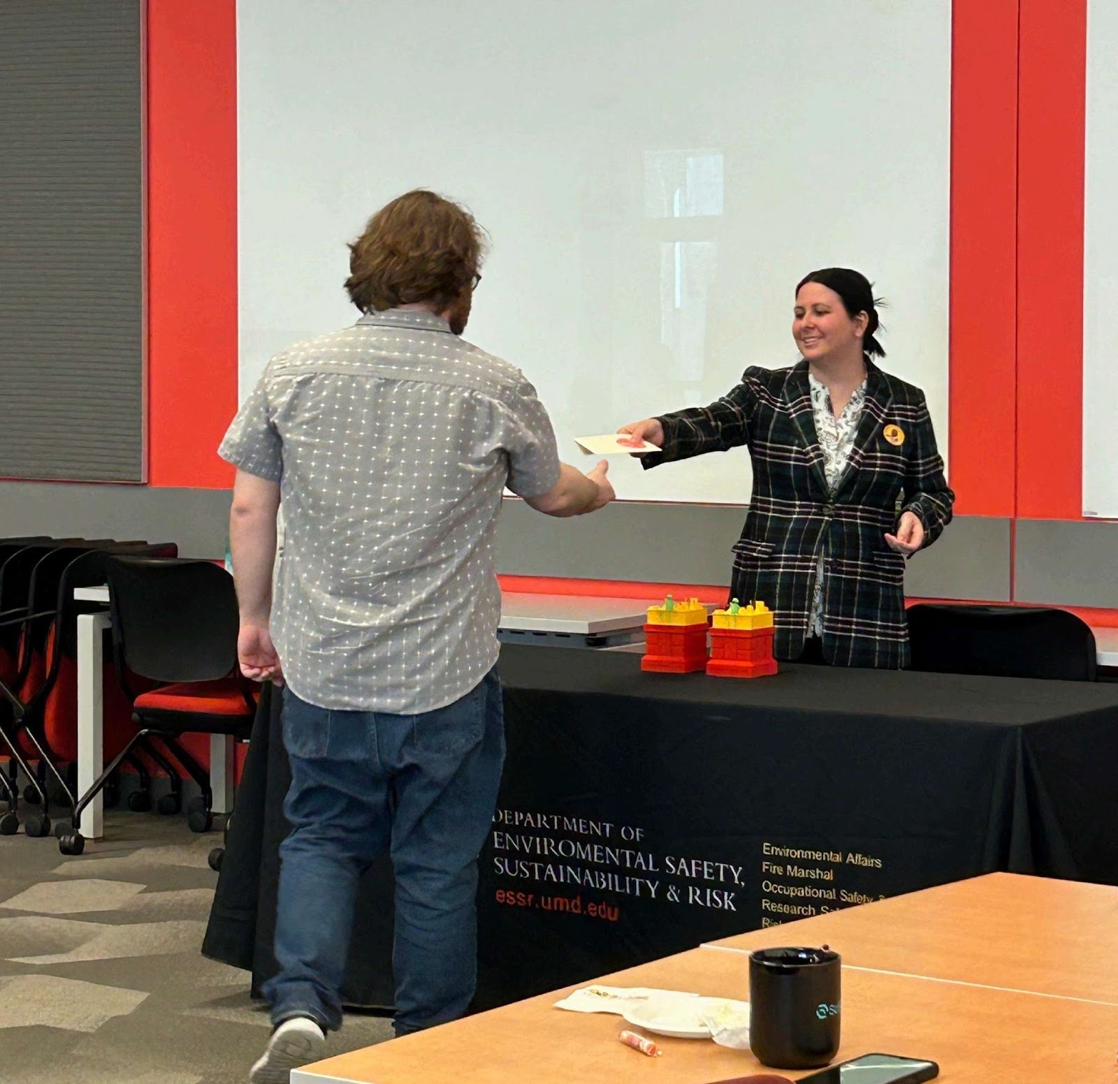 Miriam Sharp, Assistant Director of Academic & Laboratory Safety and Chemical Hygiene Officer, presents an award during Lab Safety Awareness Week.