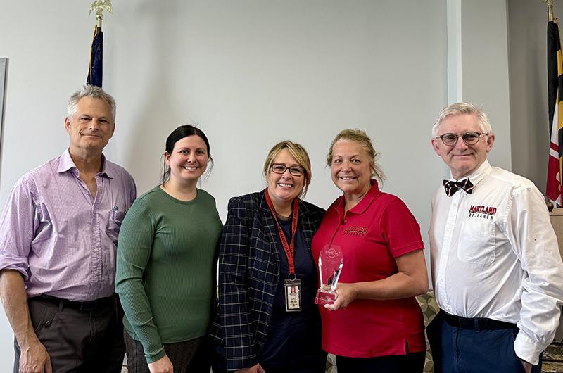 Denise Clark receiving CSHEMA award