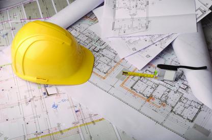 Hard hat and blueprints